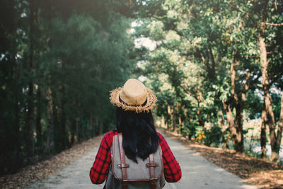 Rear view of woman walking in park