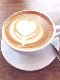 Close-up of cappuccino on table