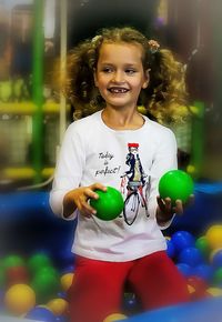 Portrait of smiling girl standing outdoors