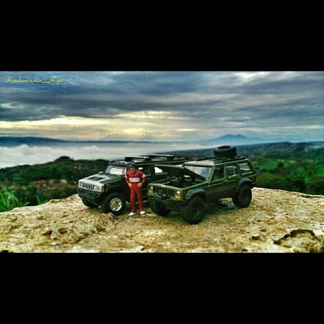 transportation, mode of transport, sky, mountain, land vehicle, tranquility, tranquil scene, landscape, nature, mountain range, scenics, beauty in nature, travel, day, cloud - sky, lake, auto post production filter, outdoors, boat, water