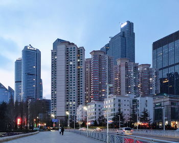 Modern buildings in city against sky