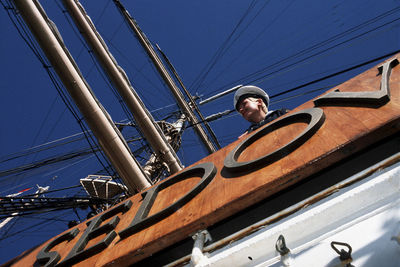 Low angle view of sailboat in sea against sky