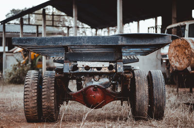 Old agricultural machinery on field