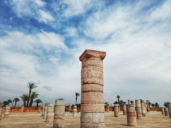 Low angle view of historical building against cloudy sky