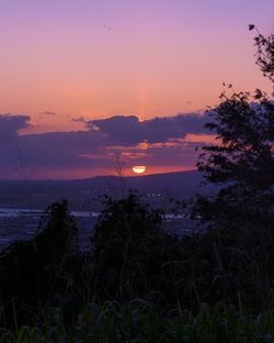 Scenic view of sea against sky at sunset