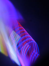 Close-up of light trails against black background