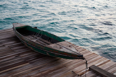 High angle view of pier with boat over sea