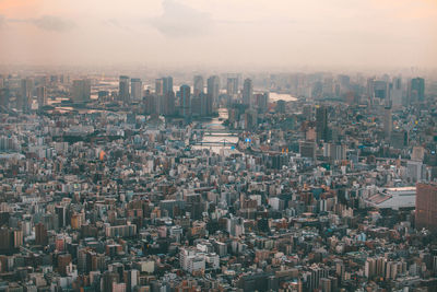 Aerial view of cityscape against sky