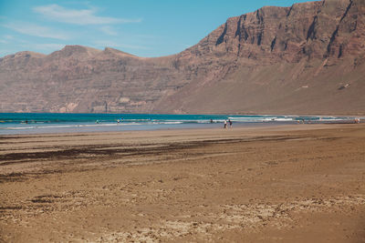 Scenic view of beach against mountains