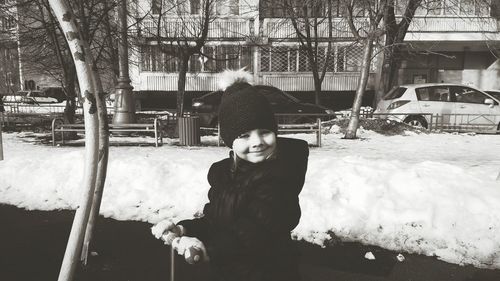 Portrait of girl in playground during winter