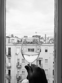 A glass of liquid in black and white