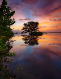 Scenic view of sea against orange sky