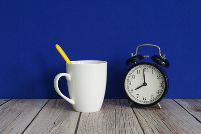 Close-up of clock on table