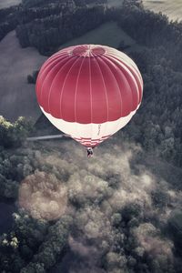 Hot air balloon flying against sky