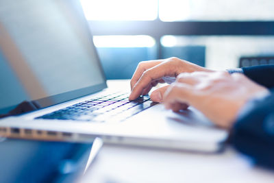 Man using laptop on table