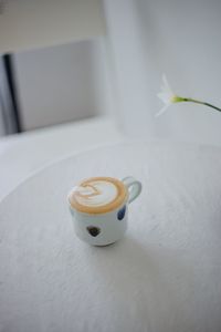 High angle view of coffee cup on table