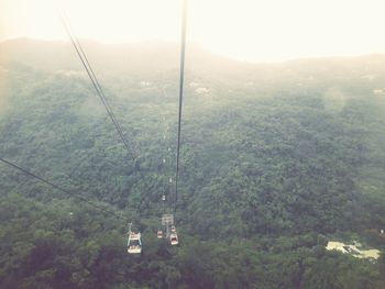 Overhead cable car against sky