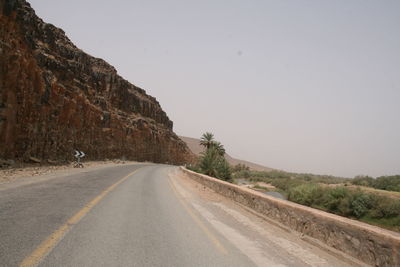 Road amidst landscape against clear sky