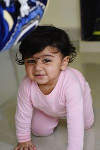 Cute baby girl at home