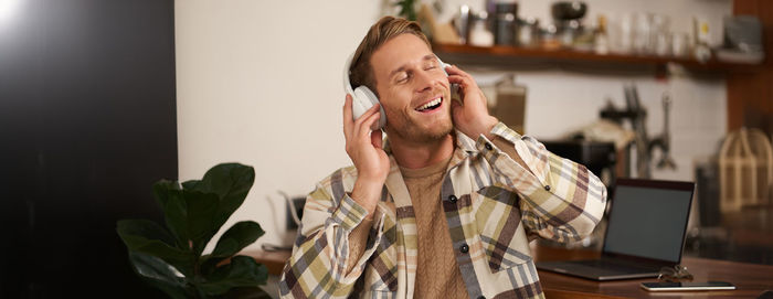 Portrait of young woman using mobile phone