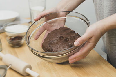 Close-up of person preparing food on table