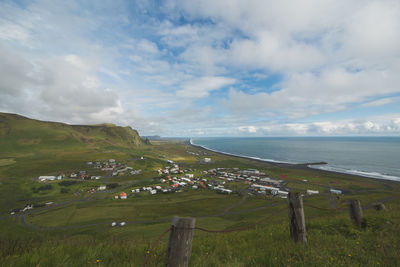 High angle view of calm sea against cloudy sky