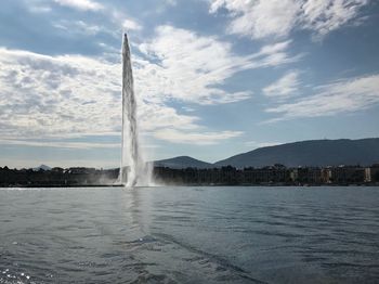 Water splashing against sky