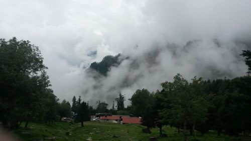 Scenic view of landscape against cloudy sky