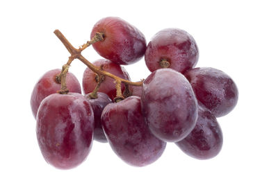 Close-up of grapes against white background