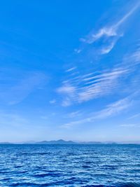 Scenic view of sea against blue sky