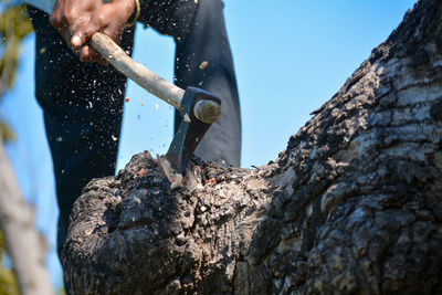 Man working on rock