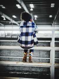 Rear view of girl dreaming of barrel racing 
