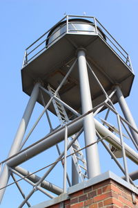 Low angle view of water tower against clear sky