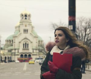 Beautiful woman standing against alexander nevsky cathedral