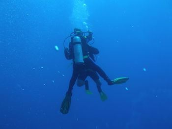 Low angle view of person swimming in sea