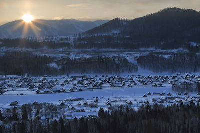 Scenic view of frozen lake against sky during winter