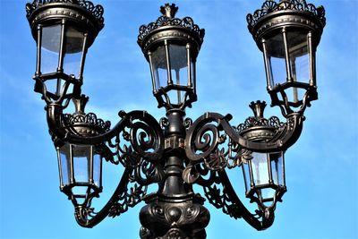 Low angle view of street light against sky