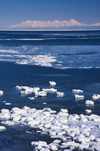 Scenic view of sea against sky during winter