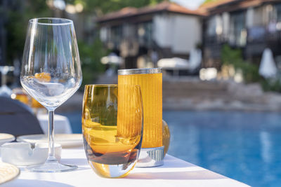Close-up of beer in glass at swimming pool