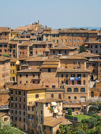 Cityscape of siena a wonderful city in tuscany and its medieval buildings seen from orto dei tolomei
