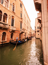 Canal passing through city buildings