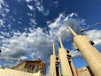 Low angle view of buildings against blue sky