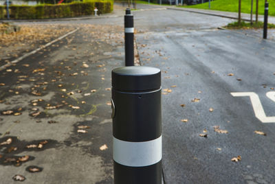 Close-up of metal pole on road