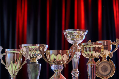 Close-up of wine glasses on table