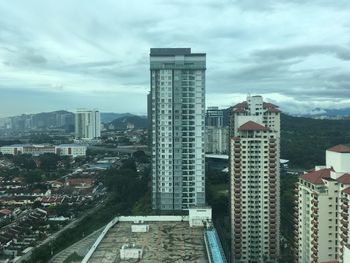 High angle view of buildings in city against sky