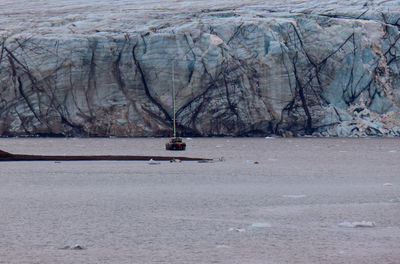Rear view of man kayaking in sea