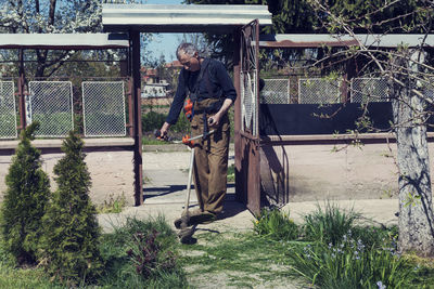 Senior man gardening at back yard