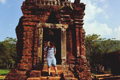 Full length of man in temple against sky