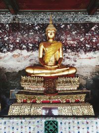 Buddha statue in temple outside building