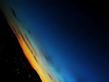 Low angle view of sea against sky during sunset